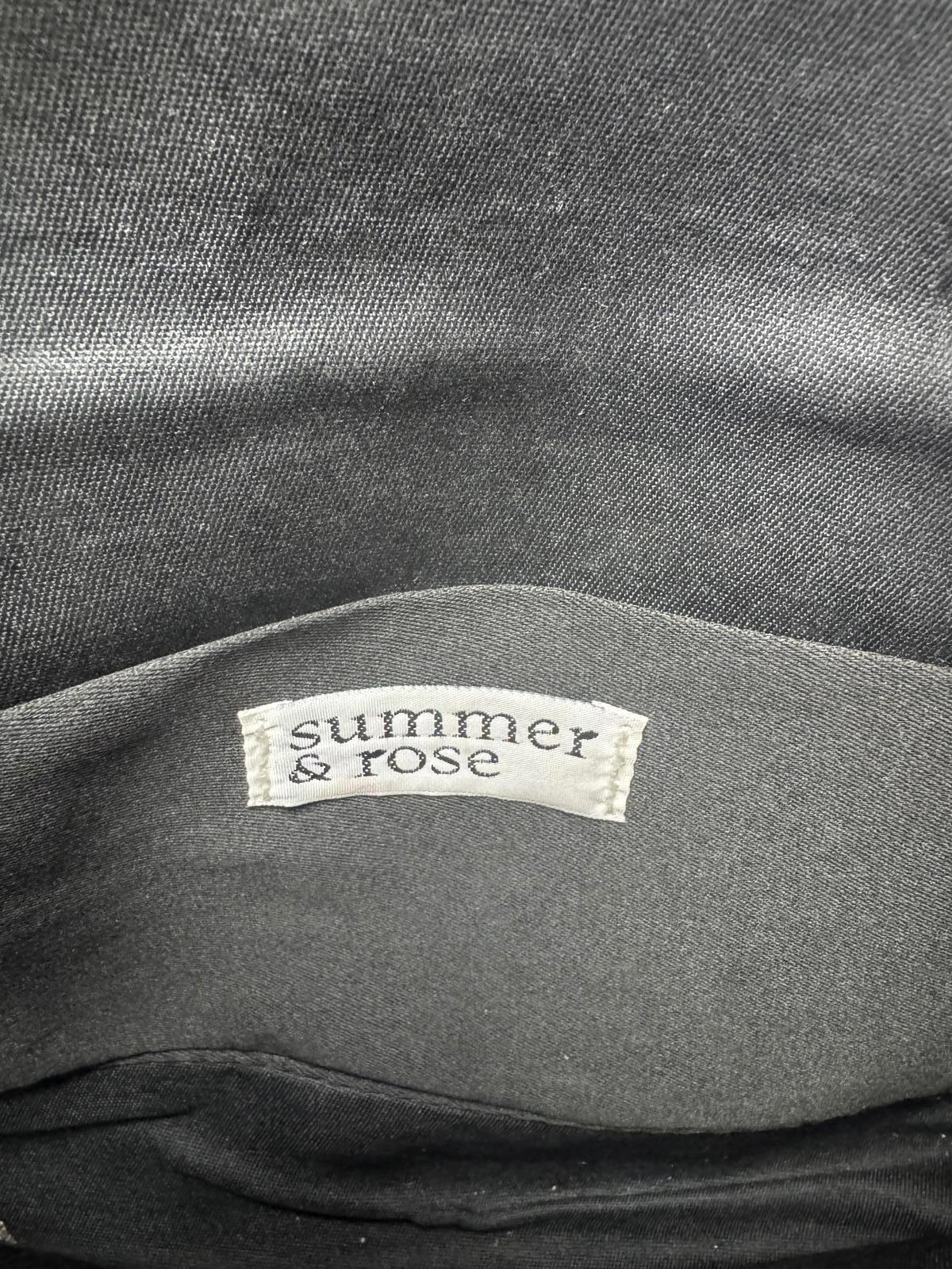 Black Faux Leather Crossbody Bag with Decorative Accent