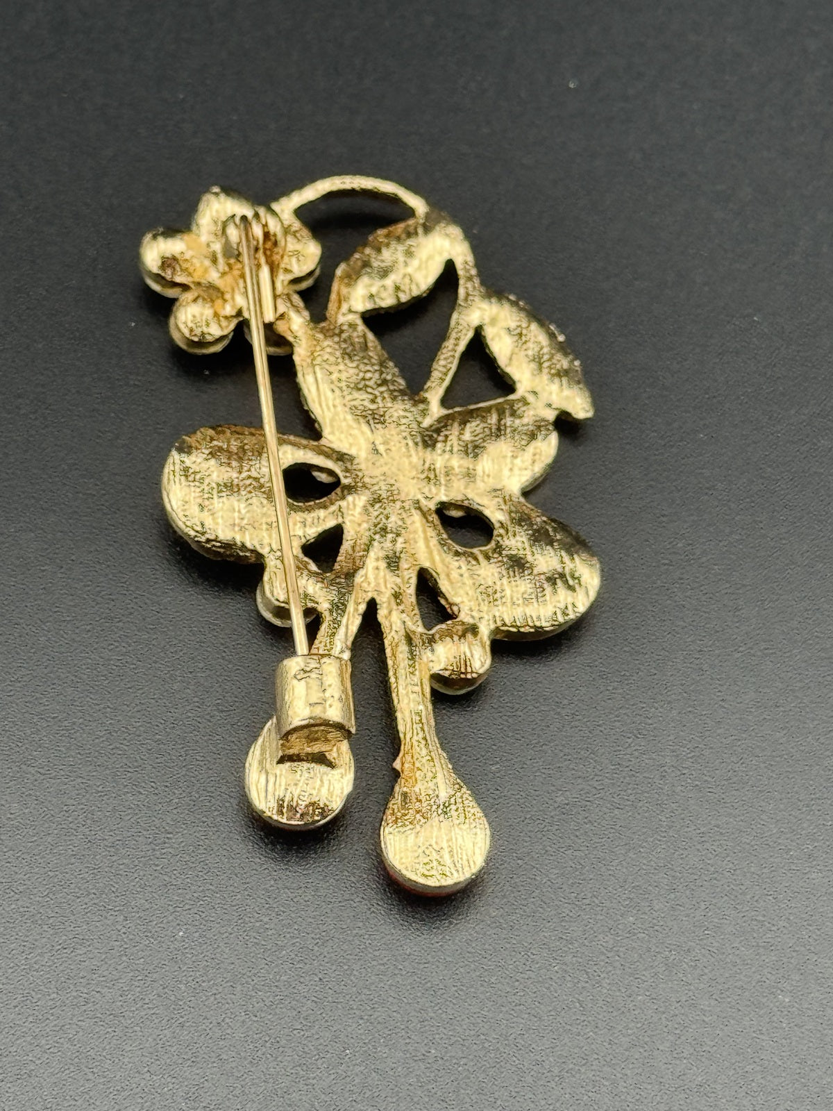 Gold Tone Floral Rhinestone Brooch with Red Teardrop