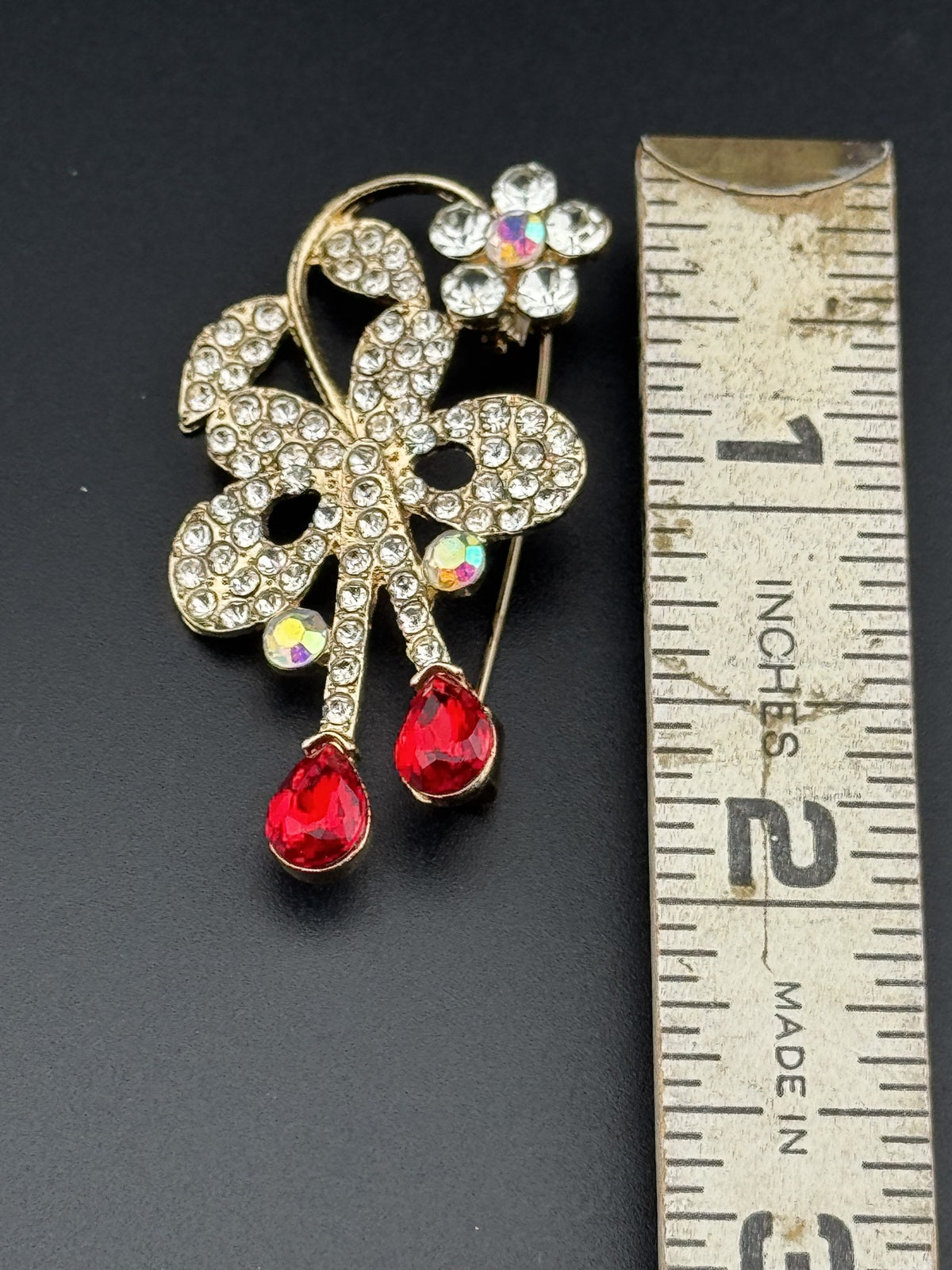 Gold Tone Floral Rhinestone Brooch with Red Teardrop