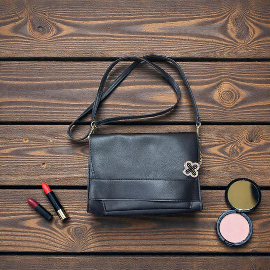 Black Faux Leather Crossbody Bag with Decorative Accent